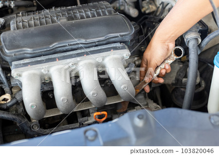 Man using wrench worker service engine mechanic garage. Car repair. Man using wrench worker service engine mechanic garage. Car repair. 103820046