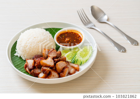 fried belly pork with rice with spicy sauce 103821862