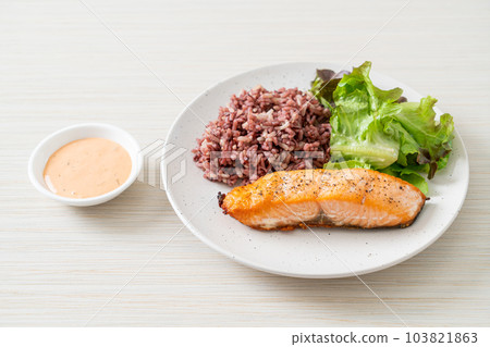 grilled salmon fillet steak with rice berry and vegetable 103821863