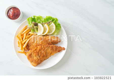 Homemade Breaded Weiner Schnitzel with Potato Chips Homemade Breaded Weiner Schnitzel with Potato Chips 103822321
