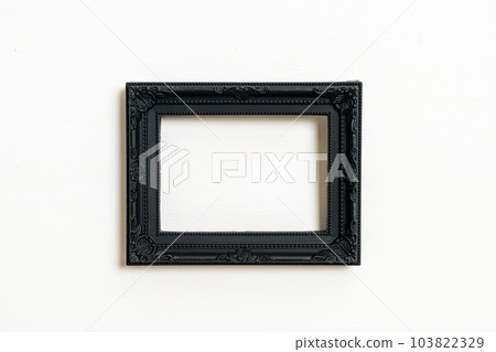 empty picture frame on white wall background 103822329