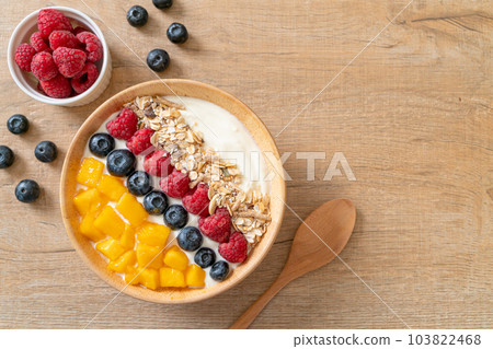 homemade yogurt bowl with raspberry, blueberry, mango and granola 103822468