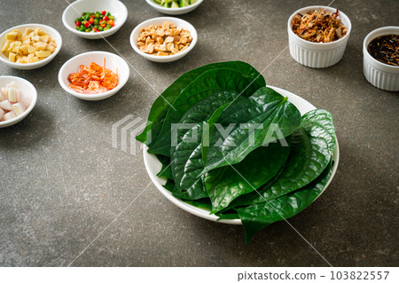 Miang kham - A royal leaf wrap appetizer 103822557