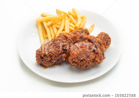 spicy Korean fried chicken with french fries 103822588