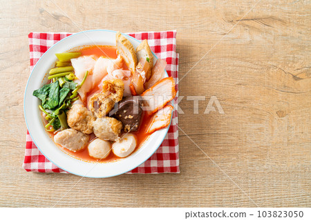 noodles with meatballs in pink soup 103823050