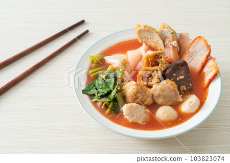 noodles with meatballs in pink soup 103823074