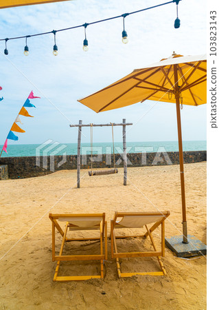 beach chair on beach with sea background 103823143