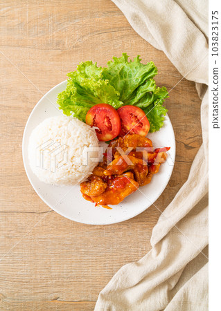 Fried fish topped by 3 flavors chili sauce with rice 103823175