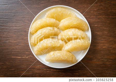 Fresh peeled pomelo, grapefruit or shaddock Fresh peeled pomelo, grapefruit or shaddock 103823258
