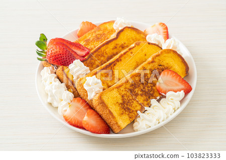 french toast with fresh strawberry and whipping cream 103823333