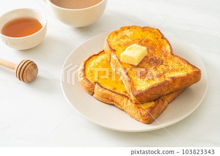 French toasted with butter and honey French toasted with butter and honey 103823343