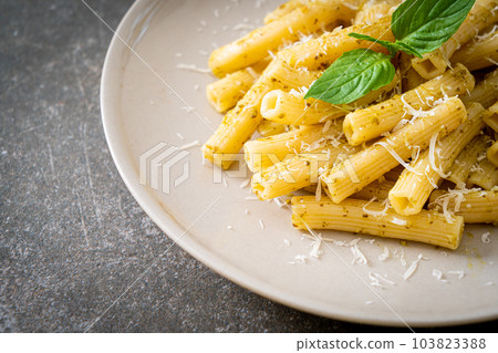 pesto rigatoni pasta with parmesan cheese pesto rigatoni pasta with parmesan cheese 103823388