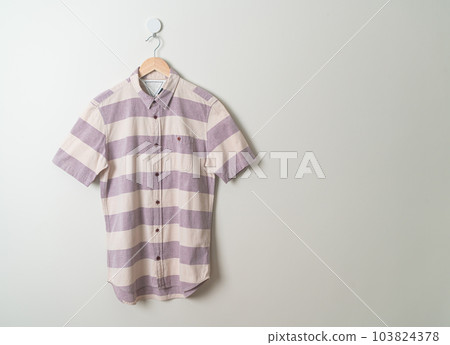 hanging shirt with wood hanger on wall hanging shirt with wood hanger on wall 103824378