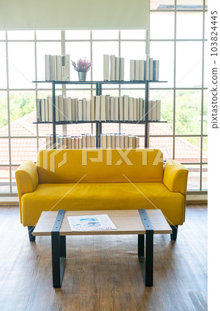empty yellow sofa decoration in a room empty yellow sofa decoration in a room 103824445