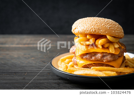 pork burger with cheese and french fries 103824476