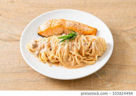 grilled salmon with spaghetti creamy tomato sauce grilled salmon with spaghetti creamy tomato sauce 103824494