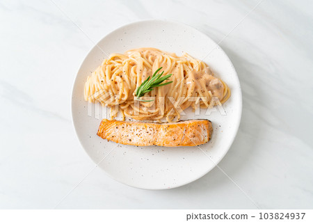 grilled salmon with spaghetti creamy tomato sauce grilled salmon with spaghetti creamy tomato sauce 103824937