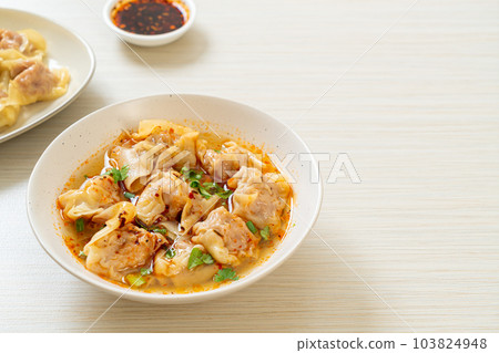 pork wonton soup or pork dumplings soup with roasted chili pork wonton soup or pork dumplings soup with roasted chili 103824948