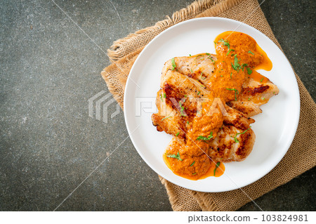 grilled chicken steak with red curry sauce grilled chicken steak with red curry sauce 103824981
