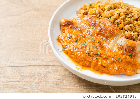 grilled chicken steak with red curry sauce and rice 103824983