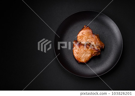 Delicious juicy pork or beef steak with salt, spices and herbs 103826201