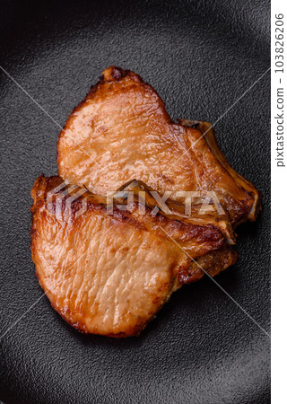 Delicious juicy pork or beef steak with salt, spices and herbs Delicious juicy pork or beef steak with salt, spices and herbs 103826206
