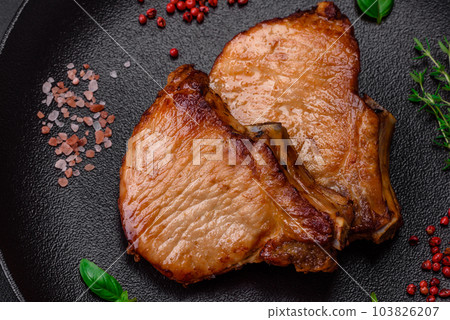 Delicious juicy pork or beef steak with salt, spices and herbs Delicious juicy pork or beef steak with salt, spices and herbs 103826207