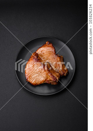 Delicious juicy pork or beef steak with salt, spices and herbs 103826234