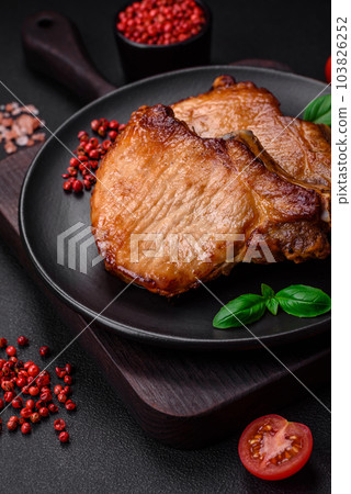 Delicious juicy pork or beef steak with salt, spices and herbs Delicious juicy pork or beef steak with salt, spices and herbs 103826252