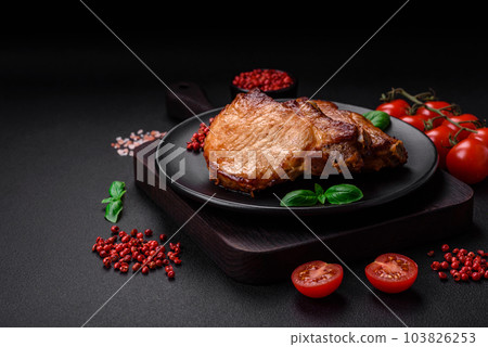 Delicious juicy pork or beef steak with salt, spices and herbs Delicious juicy pork or beef steak with salt, spices and herbs 103826253