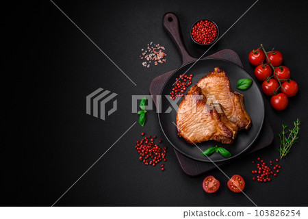 Delicious juicy pork or beef steak with salt, spices and herbs 103826254