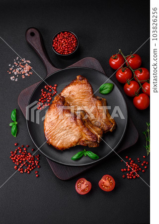 Delicious juicy pork or beef steak with salt, spices and herbs 103826256