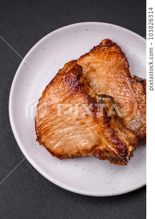 Delicious juicy pork or beef steak with salt, spices and herbs 103826314