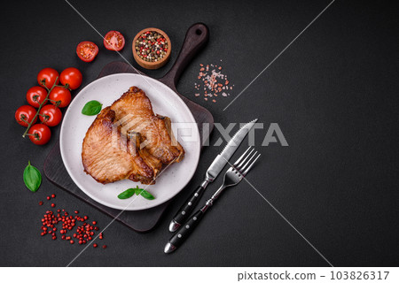 Delicious juicy pork or beef steak with salt, spices and herbs 103826317
