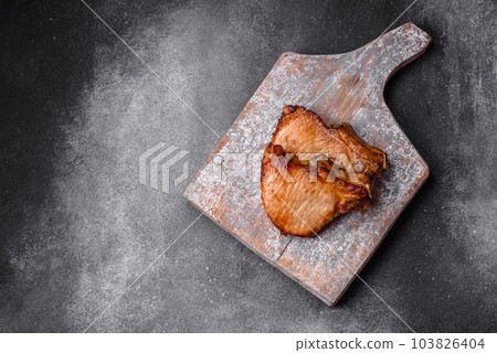 Delicious juicy pork or beef steak with salt, spices and herbs 103826404