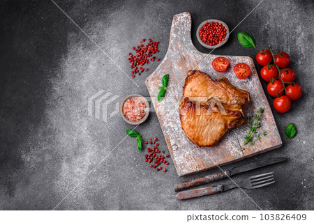 Delicious juicy pork or beef steak with salt, spices and herbs Delicious juicy pork or beef steak with salt, spices and herbs 103826409