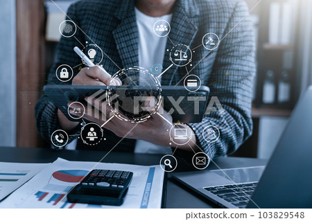 Copyright or patent concept, Person hand using laptop computer, tablet and smartphone with virtual screen copyright icon trademark, Creation ownership against piracy at office. 103829548