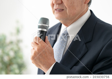 A man who speaks with a microphone Senior 103830756