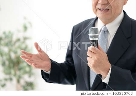 A man who speaks with a microphone Senior A man who speaks with a microphone Senior 103830763