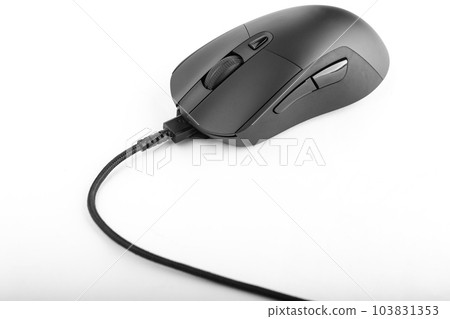 Black computer mouse with a wire on a white background. 103831353