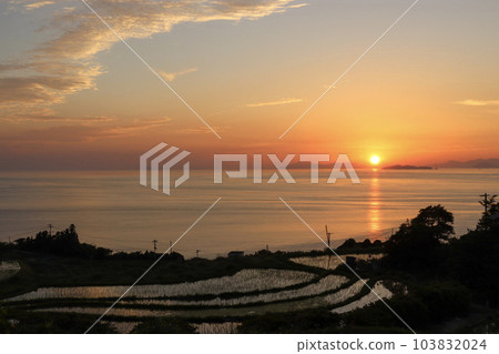 Sunset and rice terraces in the orange sunset sky 103832024