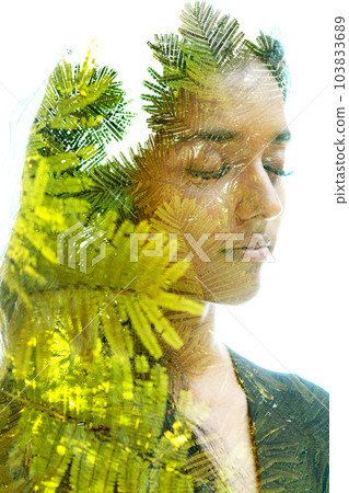 Double exposure portrait of a woman combined with green enlarged plant leaves Double exposure portrait of a woman combined with green enlarged plant leaves 103833689