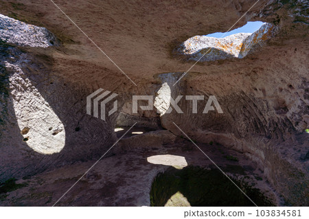 Ancient cave city. Inside the cave, view from the window. Ancient cave city. Inside the cave, view from the window. 103834581