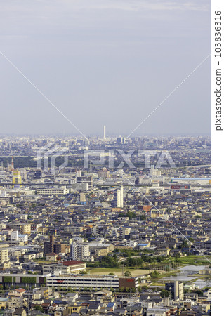 View of Gifu City, Ginan Town, and Ichinomiya City seen from Mt. Kinka in the evening 103836316