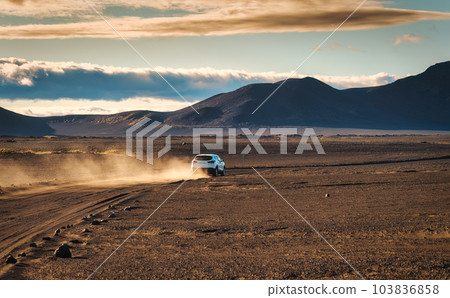 4wd car driving with dusty icelandic highlands in summer 4wd car driving with dusty icelandic highlands in summer 103836858