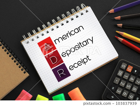 ADR American Depositary Receipt - certificate issued by a U.S. bank that represents shares in foreign stock, acronym text on notepad concept background ADR American Depositary Receipt - certificate issued by a U.S. bank that represents shares in foreign stock, acronym text on notepad concept background 103837939