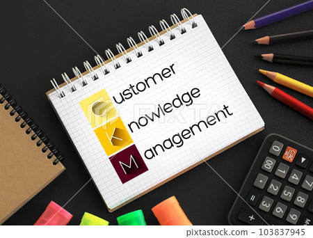 CKM - Customer Knowledge Management acronym on notepad, business concept background CKM - Customer Knowledge Management acronym on notepad, business concept background 103837945