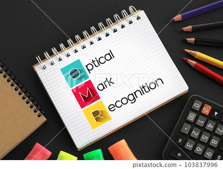 OMR Optical Mark Recognition - process of reading information that people mark on surveys, tests and other paper documents, acronym text on notepad 103837996