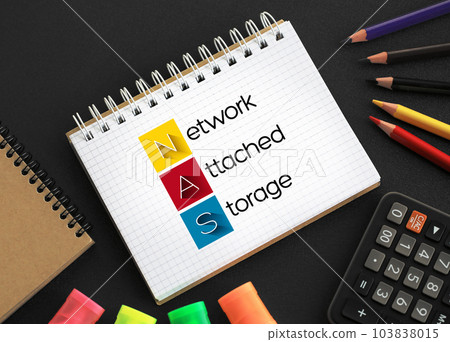 NAS Network-Attached Storage - file-level computer data storage server connected to a computer network, acronym text on notepad 103838015