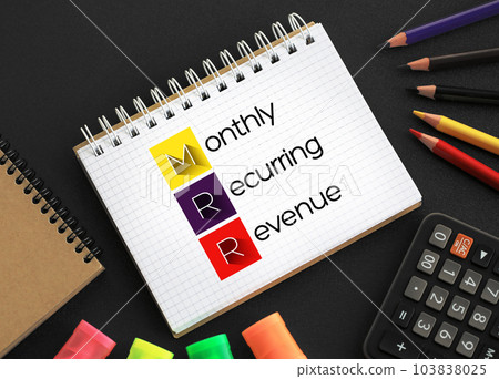 MRR - Monthly Recurring Revenue acronym on notepad, business concept background 103838025